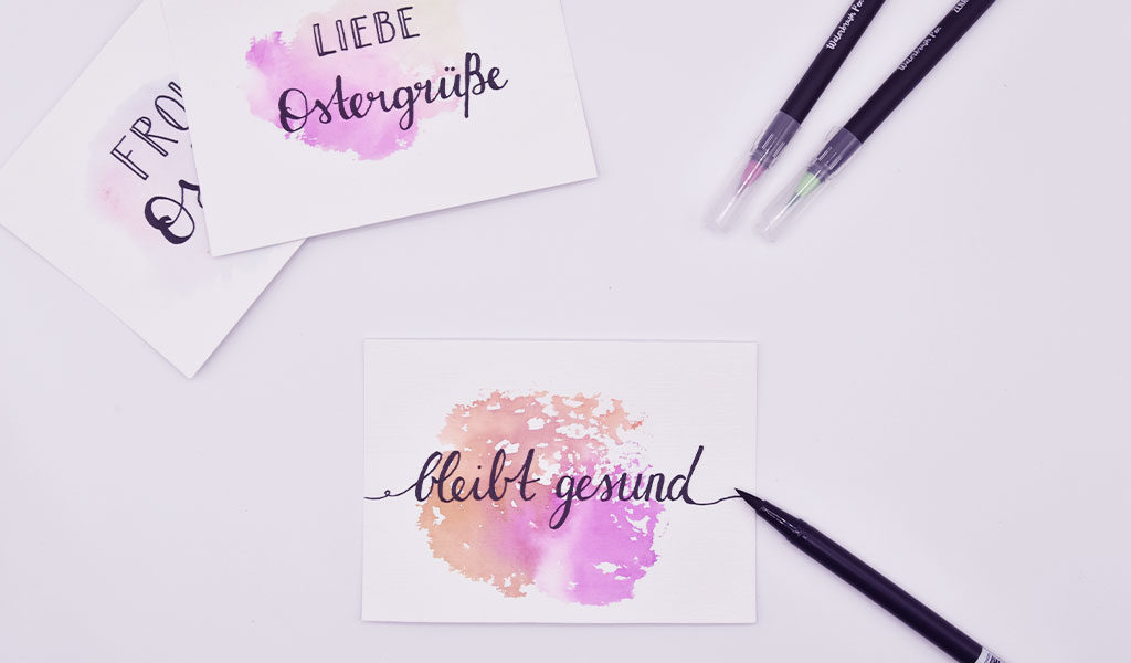 Aquarell-Karte mit Aufschrift "Bleibt gesund"