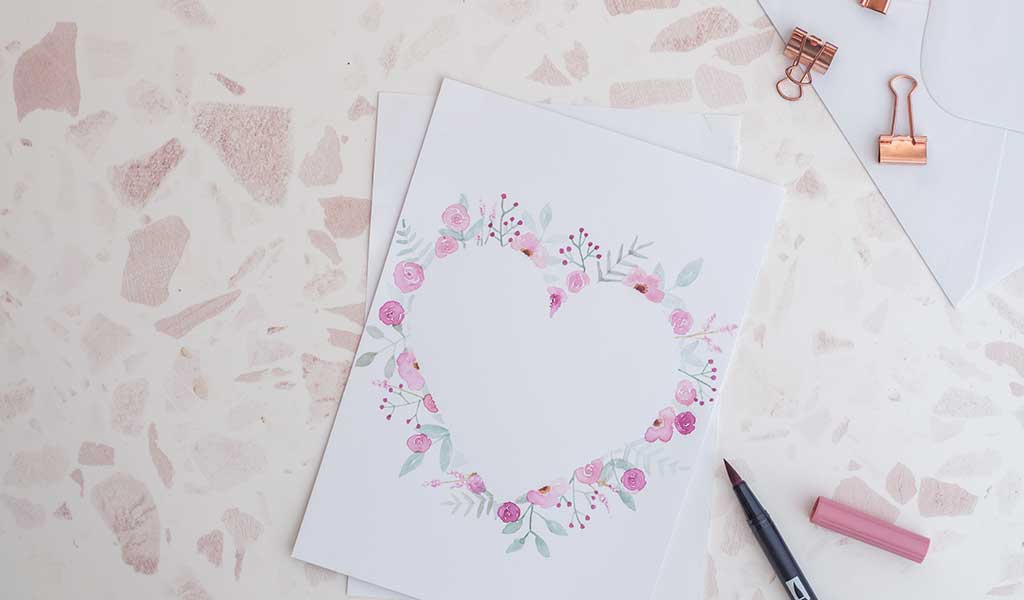 Hübsche Karte mit Aquarell-Blumen in Herzform zum Valentinstag verschenken